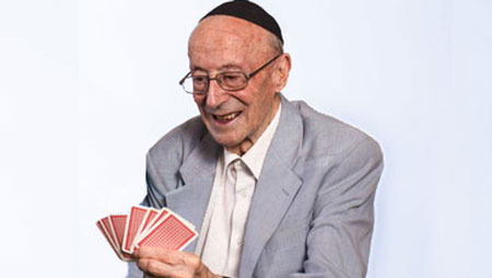 Smiling senior happy about card hand